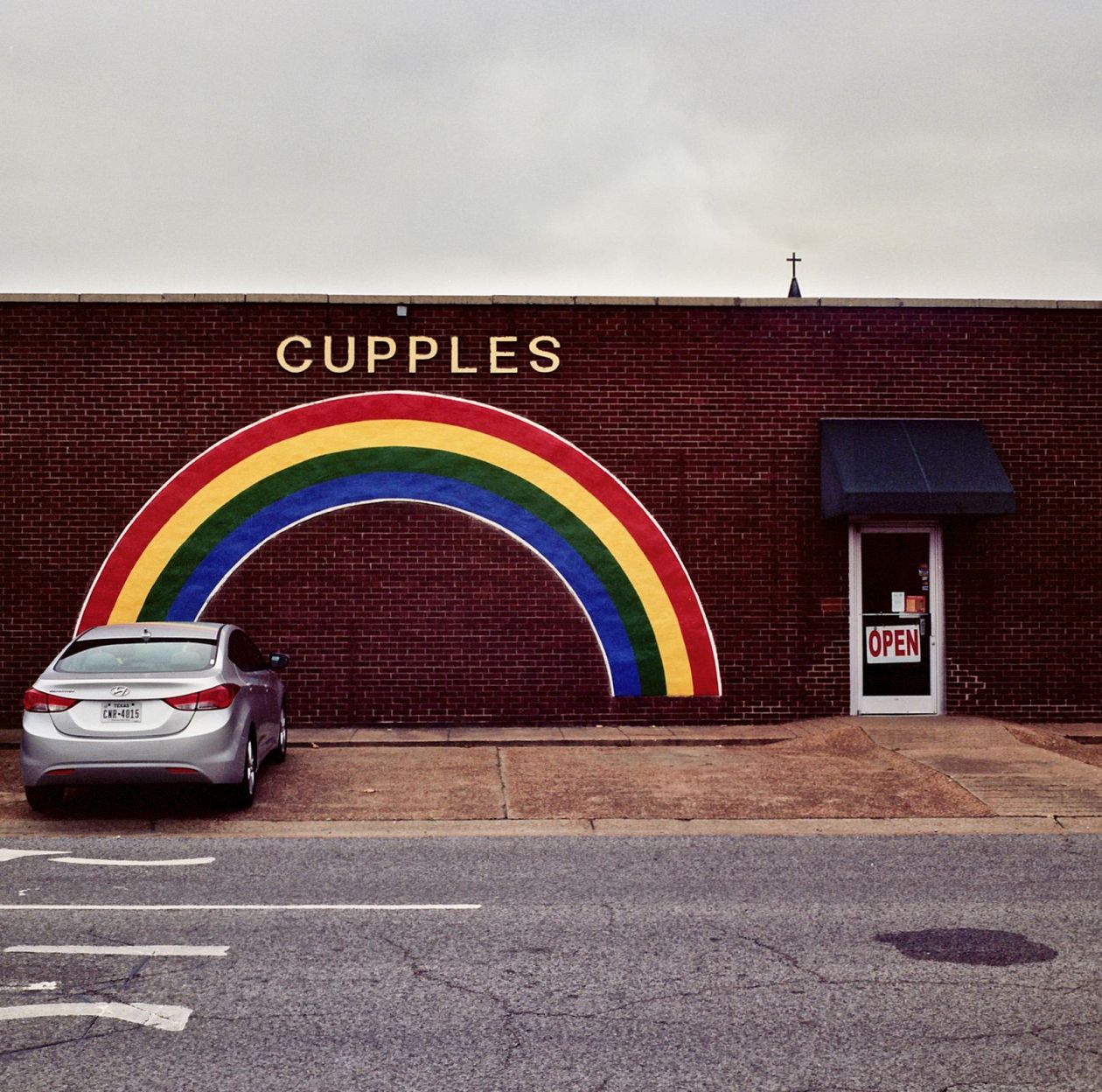 Rainbow sign on a wall in West Memphis, Arkansas
