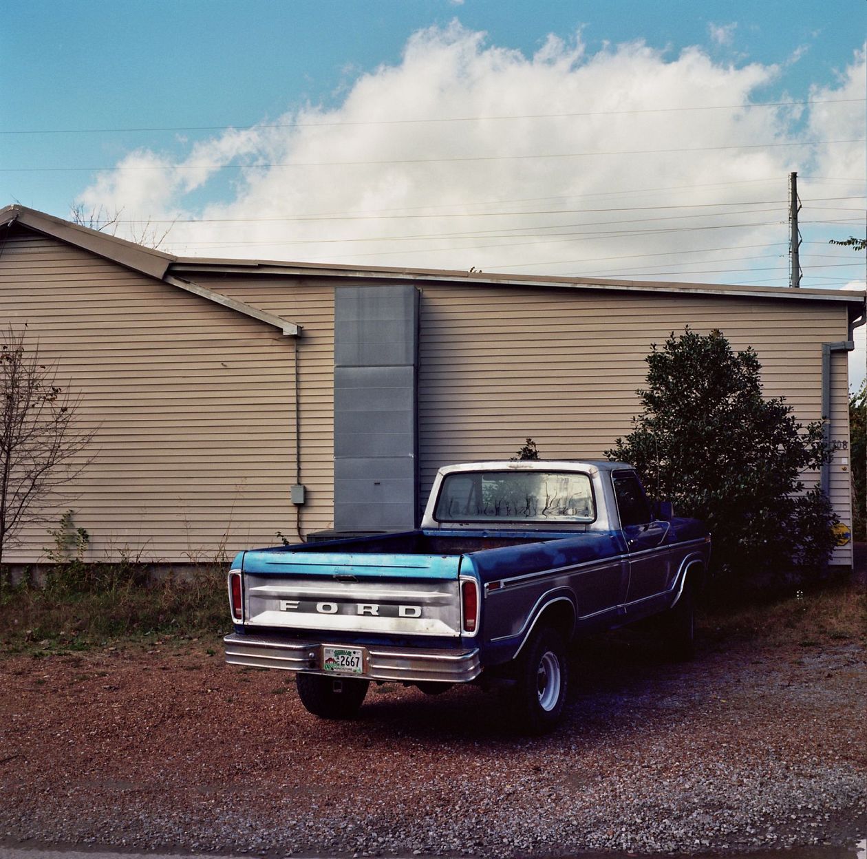 Vintage american pickup truck parked in front of a garage. Nashville