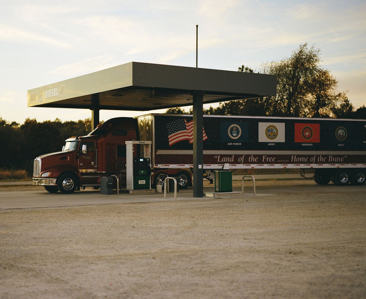 Oil and gas station with an american army truck