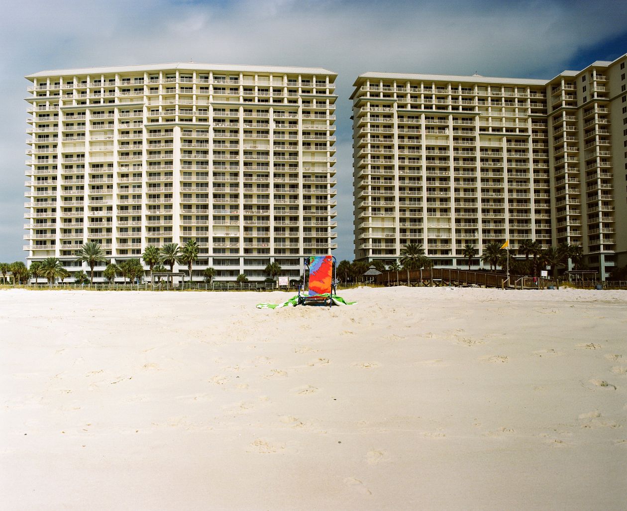 Surfers and hotels on the beach in Mobile, Alabama.